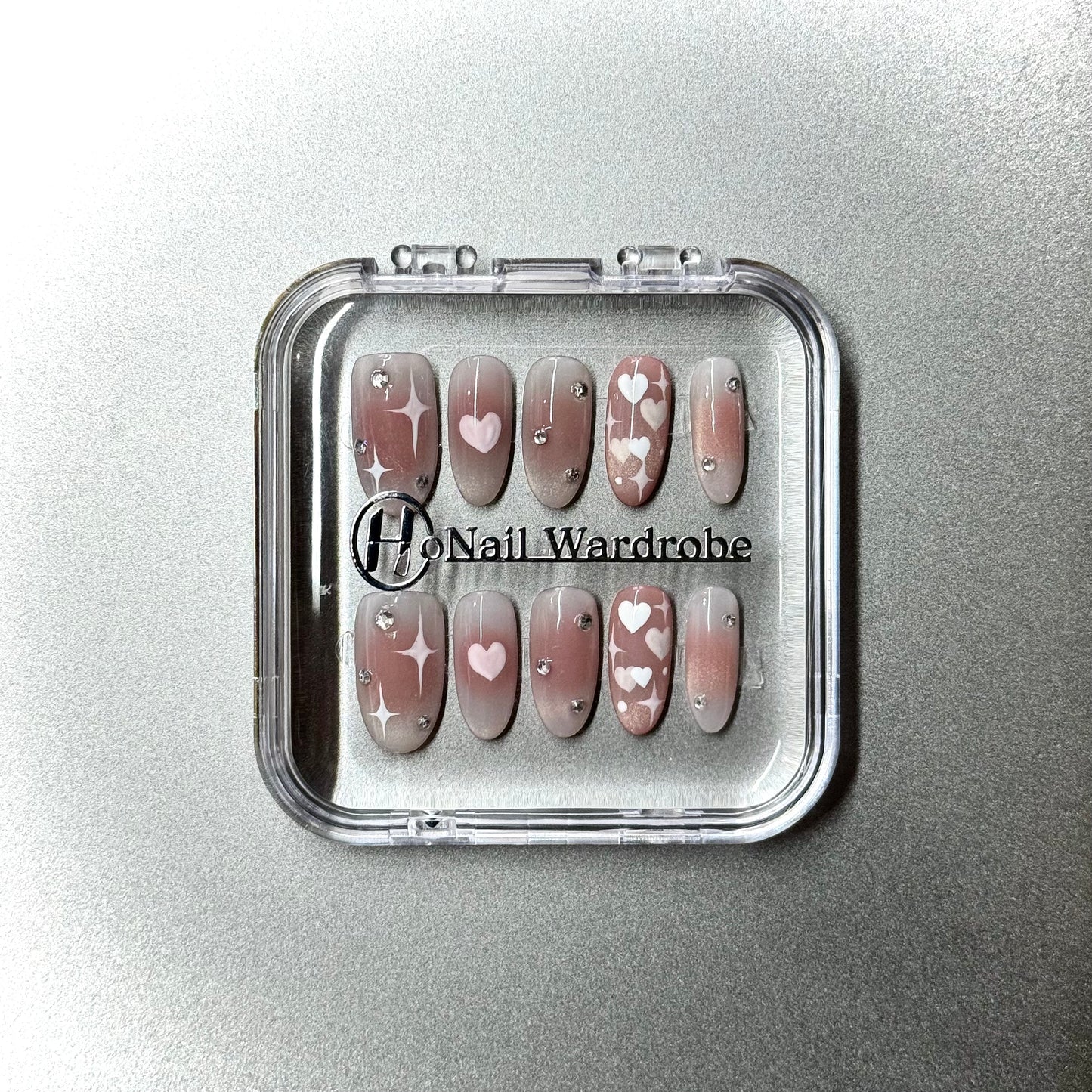 Sweetheart Cat Eye (Medium Oval) press on nail in a honail wardrobe box
