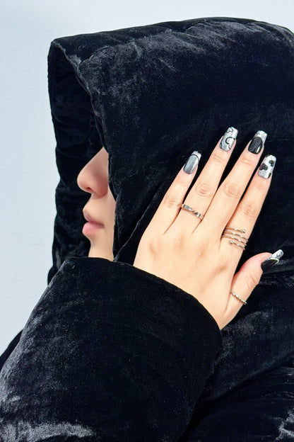 Chic Noir press-on nail with black feather jacket
