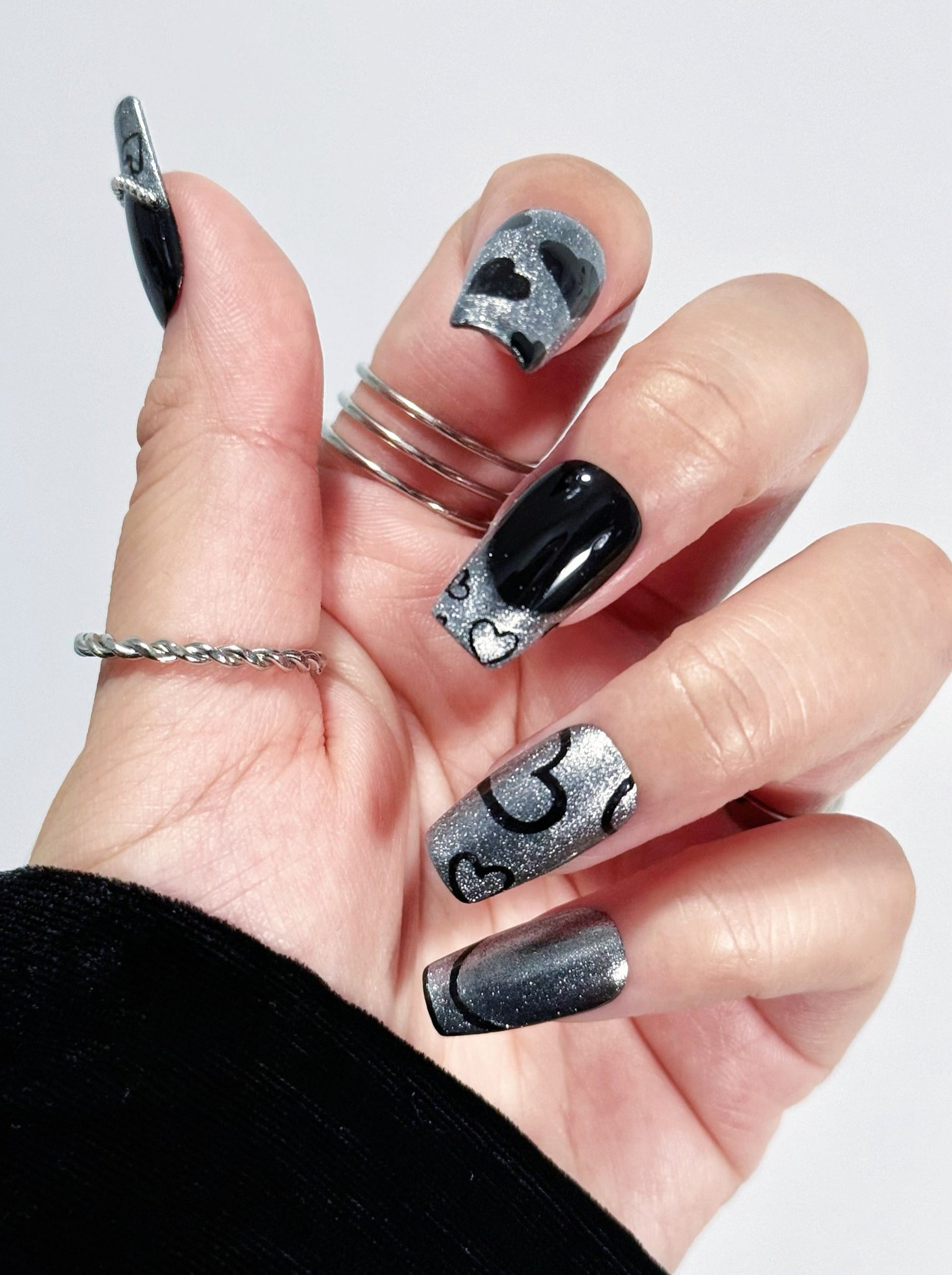 Chic Noir press-on nail fist posture