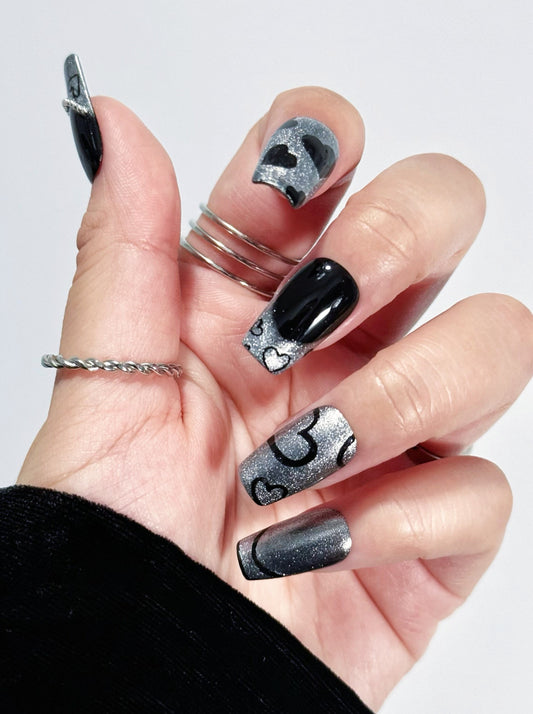 Chic Noir press-on nail fist posture
