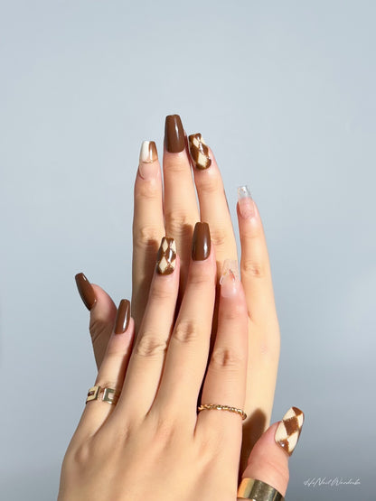 Golden Checkmate Elegance press-on nail two hands together